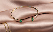 14k yellow gold bangle set with a matching pair oval Cut emerald in India, UK, USA, All Country